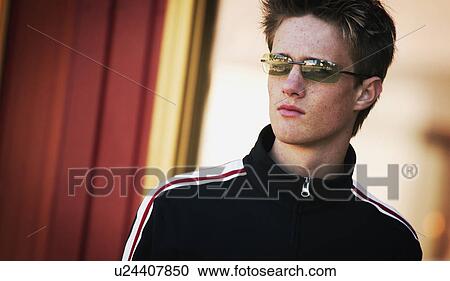 Stock Image - Portrait of a man with sunglasses. Fotosearch