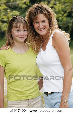 Portrait of a mother and daughter View Large Photo Image Picture - Portrait of a mother and daughter. Fotosearch