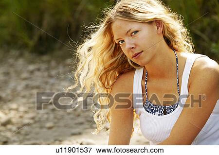Stock Photo - Portrait of a woman outside. Fotosearch
