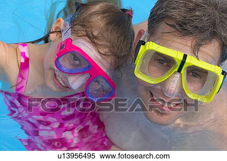 Stock Photography - Portrait of Father and Daughter Snorkeling. Fotosearch