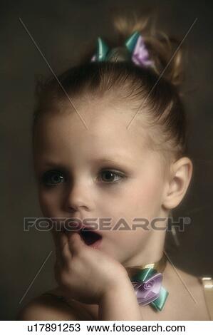 Stock Image - Portrait of Girl getting ready for dance recital. Fotosearch