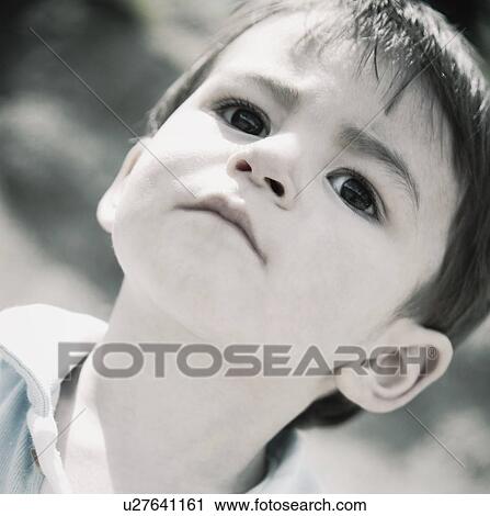 Portrait of serious young boy View Large Photo Image Stock Image - Portrait of serious young boy. Fotosearch