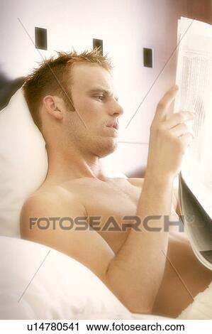 Reading the paper View Large Photo Image Stock Image - Reading the paper. Fotosearch