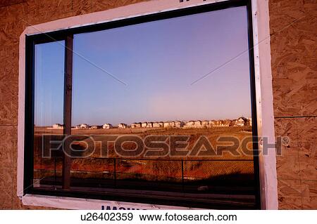 Stock Photo - Reflection of landscape in window. Fotosearch