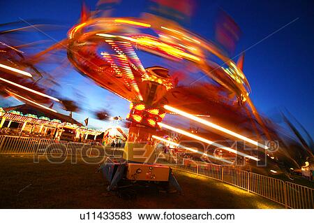 Stock Image - Ride at an amusement park. Fotosearch