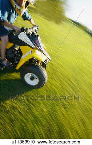 Riding a quad View Large Photo Image Stock Image - Riding a quad. Fotosearch