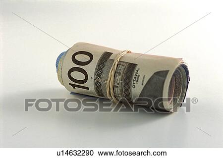 Stock Image - Roll of money with a hundred on outside. Fotosearch