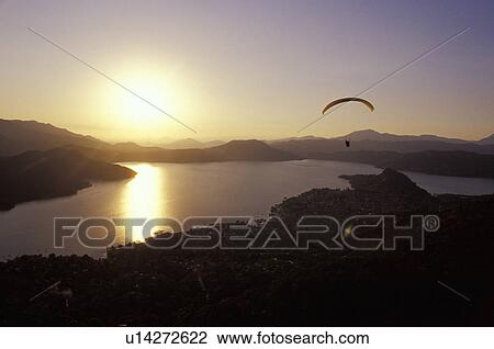 Scenic view of para glider over lake View Large Photo Image Stock Image - Scenic view of para glider over lake. Fotosearch