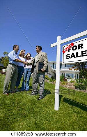Shaking hands with realtor View Large Photo Image Stock Photo - Shaking hands with realtor. Fotosearch