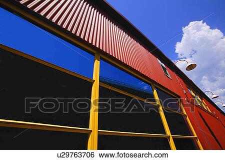 Side of building against sky View Large Photo Image Stock Photograph - Side of building against sky. Fotosearch