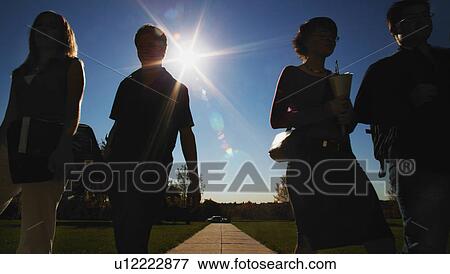 Silhouette group walking View Large Photo Image Stock Photo - Silhouette group walking. Fotosearch