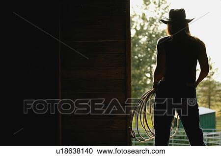 Silhouette of a cowgirl View Large Photo Image Stock Image - Silhouette of a cowgirl. Fotosearch