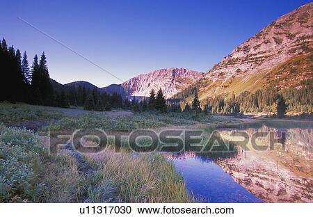 Small mountain river flowing into calm pool View Large Photo Image Stock Image - Small mountain river flowing into calm pool. Fotosearch