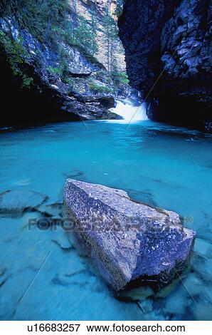 Small waterfall and river at bottom of canyon View Large Photo Image Stock Photo - Small waterfall and river at bottom of canyon. Fotosearch