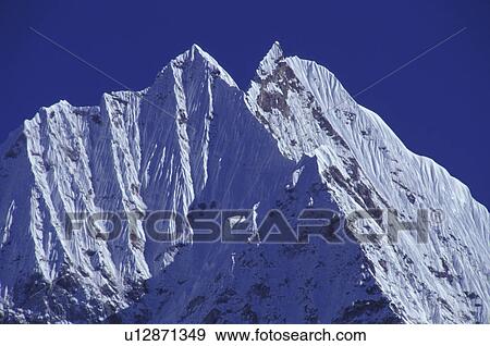 Snow covered mountain View Large Photo Image Stock Photo - Snow covered mountain. Fotosearch
