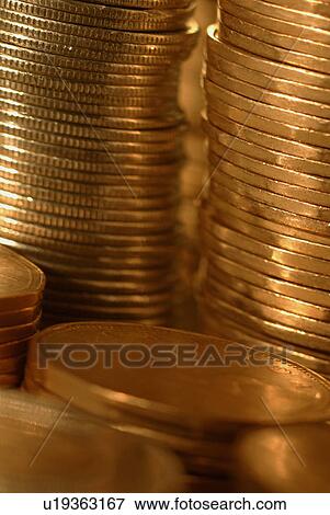 Stacks of loonies (closeup) View Large Photo Image Stock Photo - Stacks of loonies (closeup). Fotosearch
