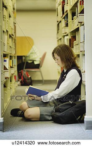 Student studies in library View Large Photo Image Stock Image - Student studies in library. Fotosearch