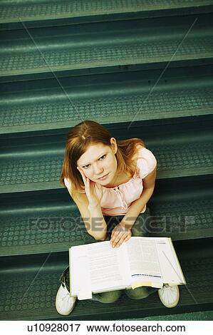 Student studying on stairs View Large Photo Image Stock Photo - Student studying on stairs. Fotosearch