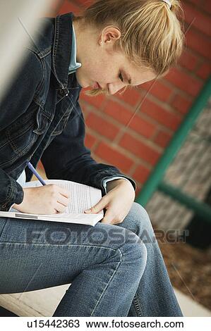 Stock Image - Student working alone. Fotosearch