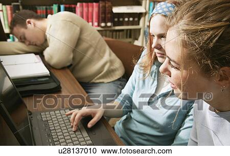 Students in a library View Large Photo Image Stock Image - Students in a library. Fotosearch
