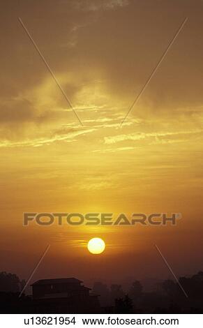 Sunset over a house View Large Photo Image Picture - Sunset over a house. Fotosearch