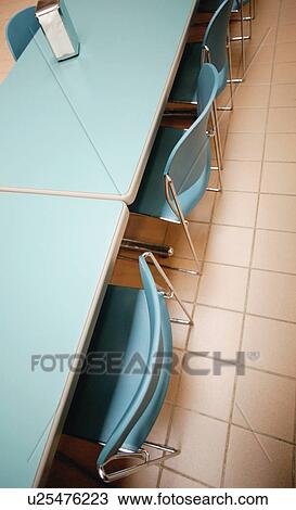 Tables and chairs in a school cafeteria View Large Photo Image Stock Image - Tables and chairs in a school cafeteria. Fotosearch