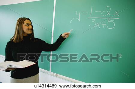 Stock Photo - Teacher in classroom. Fotosearch