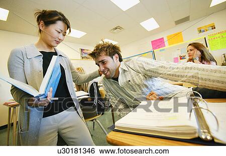 Teacher pulling students ear View Large Photo Image Stock Photograph - Teacher pulling students ear. Fotosearch