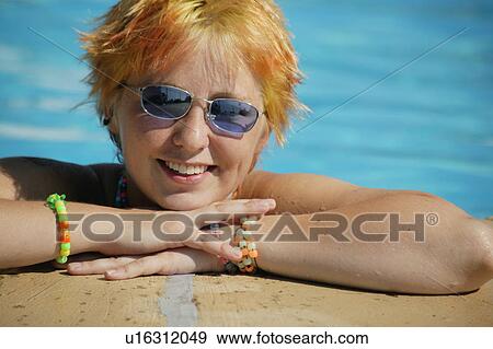 Stock Photo - Teenager in a swimming pool. Fotosearch