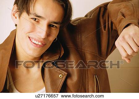 Teenager in brown leather jacket View Large Photo Image Stock Photo - Teenager in brown leather jacket. Fotosearch
