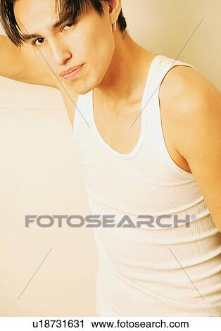 Stock Image - Teenager looking into camera. Fotosearch