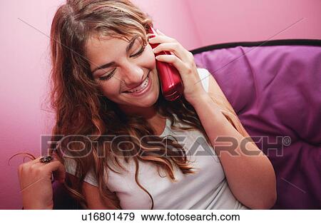 Teenager talks on the phone View Large Photo Image Stock Photo - Teenager talks on the phone. Fotosearch