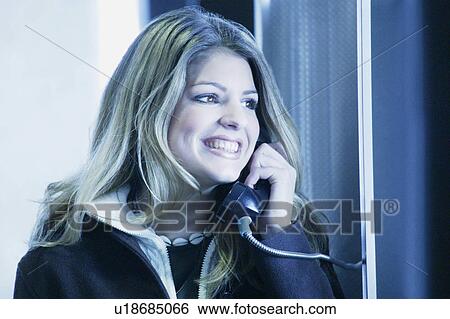 Teenager talks on the phone View Large Photo Image Stock Photograph - Teenager talks on the phone. Fotosearch