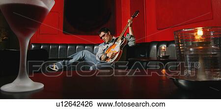 Teenager with guitar View Large Photo Image Stock Photograph - Teenager with guitar. Fotosearch
