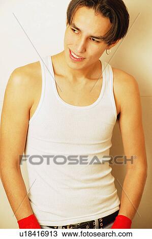 Stock Image - Teenager with hands in pockets. Fotosearch