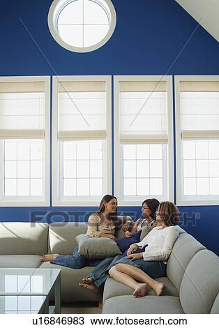 Stock Image - Three girlfriends. Fotosearch