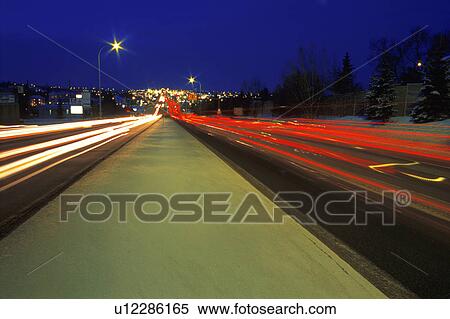 Stock Photography - Traffic driving down street. Fotosearch