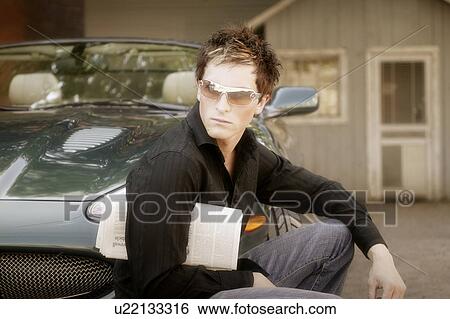 Stock Photograph - Trendy man wearing sunglasses. Fotosearch