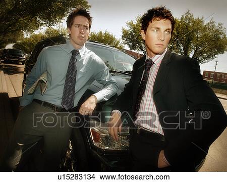 Picture - Two businessmen outside. Fotosearch
