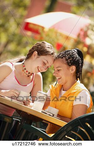 Two girls have coffee View Large Photo Image Stock Photograph - Two girls have coffee. Fotosearch