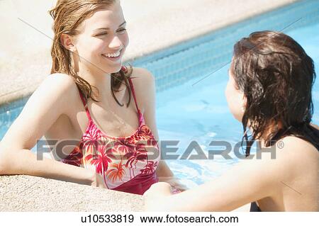 Stock Photo - Two girls in a pool. Fotosearch