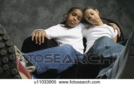 Two girls pout together View Large Photo Image Stock Photography - Two girls pout together. Fotosearch