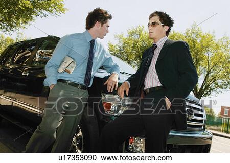 Stock Image - Two men have a conversation. Fotosearch
