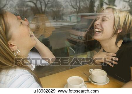 Stock Photo - Two women laughing. Fotosearch