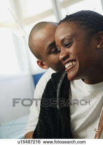 Stock Photograph - Whispering sweet nothings. Fotosearch