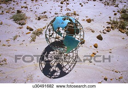 Wire globe outside on sand View Large Photo Image Stock Image - Wire globe outside on sand. Fotosearch