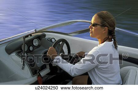 Woman driving speedboat View Large Photo Image Stock Image - Woman driving speedboat. Fotosearch