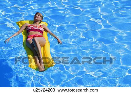 Woman in swimming pool View Large Photo Image Stock Image - Woman in swimming pool. Fotosearch