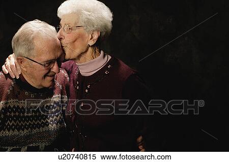 Woman kisses man View Large Photo Image Stock Photography - Woman kisses man. Fotosearch