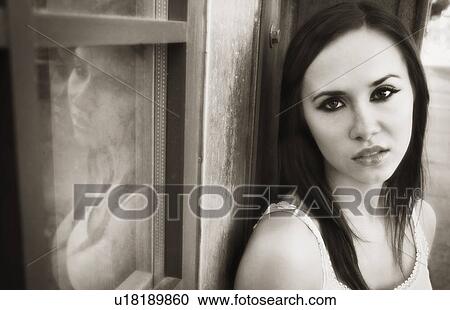 Woman leans against a wall View Large Photo Image Stock Image - Woman leans against a wall. Fotosearch